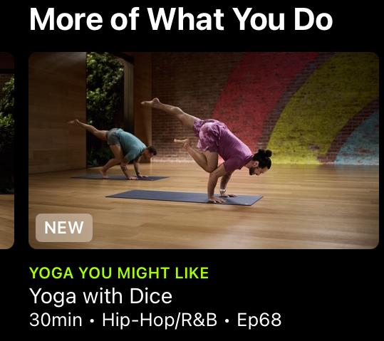 Screen shot of Apple Fitness+ with a yoga instructor doing a complicated pose on his hands with one knee on his elbow and one leg outstretched. 